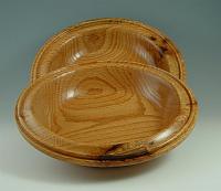 Collection plates for a local church.  Oak, about 12" diameter and 1-1/2" deep.