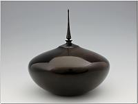 Dark Reflections 
 
Maple hollow form, 6  high to top of finial x 6  diameter x a hair over 1/16 thick. Sanded to 400 grit, dyed black and has...