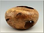 Oak Burl Hollow Form 
 
6 diameter x 3.75 high and it is thin! 
 
Now in a private collection.